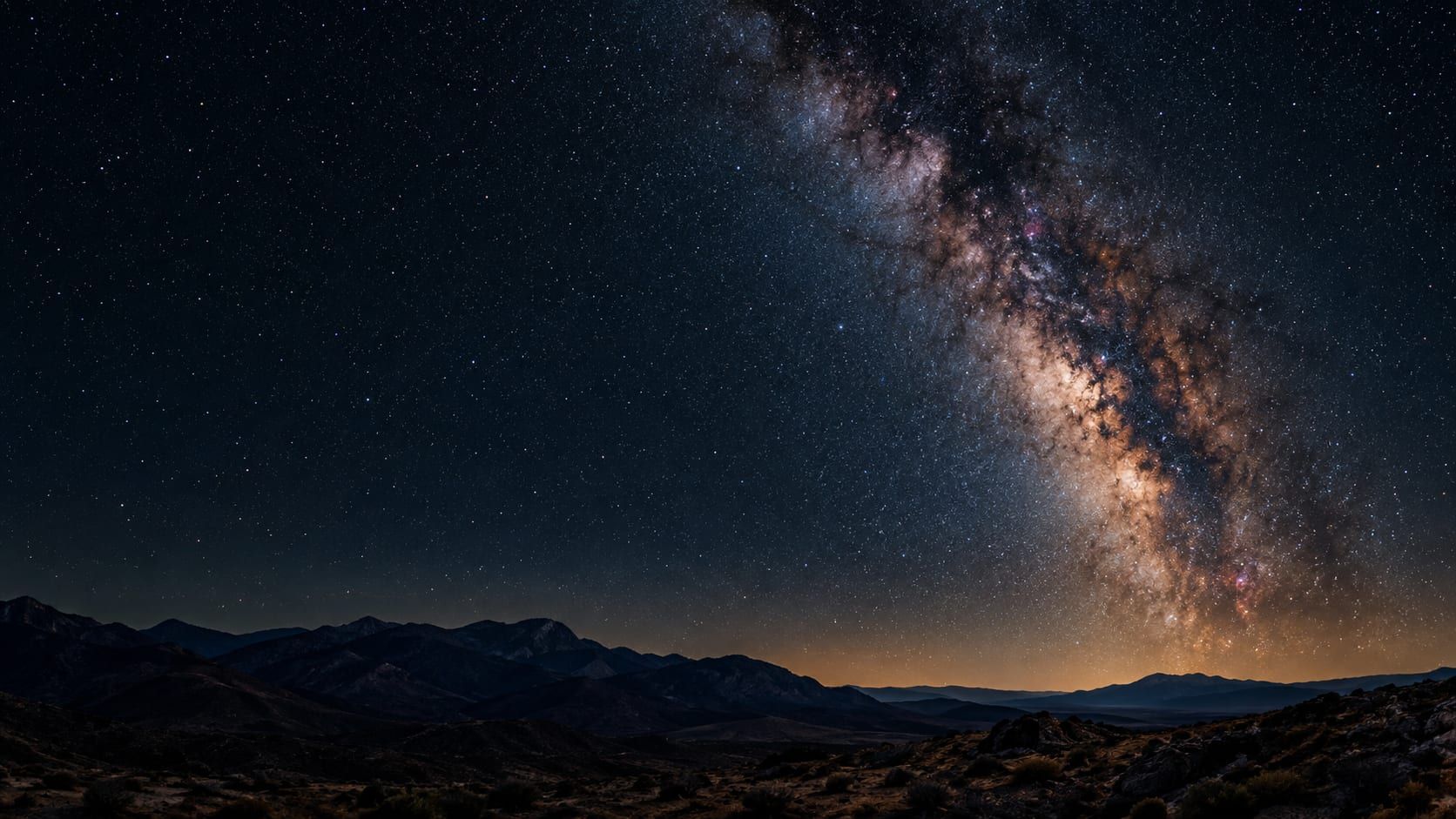 Milky Way over a dark night landscape for stargazing